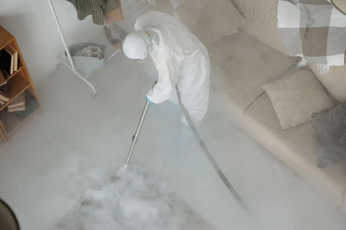 Biohazard cleanup technician in protective equipment, Madison Center, CT